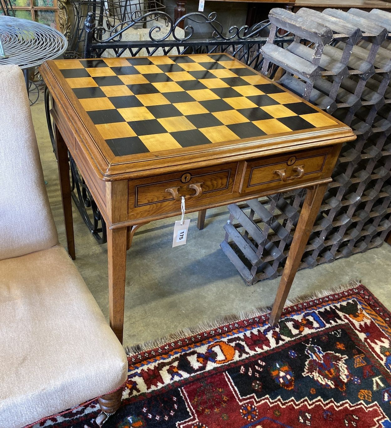 An early 20th century Continental square oak parquetry top four drawer chess table, 64cm, height 76cm